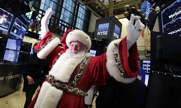 FILE - In this Wednesday, Nov. 25, 2015, file photo, Santa Claus visits the trading floor of the Ne...