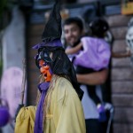 An effigy of a witch is displayed outside a house as residents make the rounds to ask for candy, chocolates and sweets known as "trick or treat" on Halloween  Saturday, Oct. 31, 2015, the eve of the observance of All Saint's Day at suburban Makati city east of Manila, Philippines. Roman Catholics and other Christians all over the world pay their respects to the dead every Nov.1 with prayers and visits to cemeteries and memorial parks. (AP Photo/Bullit Marquez)