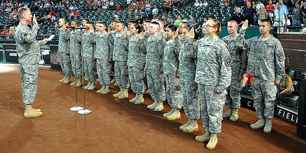 Arizona National Guard members take their oath at an Arizona Diamondbacks game on Aug. 23, 2014. (A...