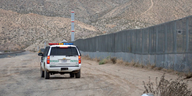 In this Jan. 4, 2016 photo, a U.S. Border Patrol agent patrols Sunland Park along the U.S.-Mexico b...