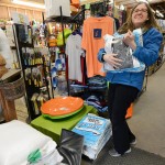 Christine Perusz loads up on ice-melting chemicals at Barnes Supply Co., Thursday, Jan. 21, 2016, in Durham, N.C. (Bernard Thomas/The Herald-Sun via AP)
