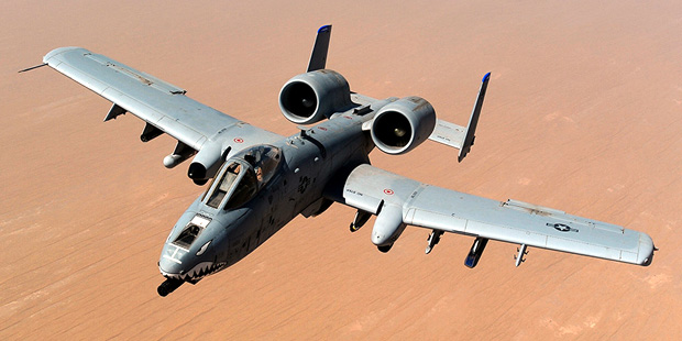 An A-10 Thunderbold II from the 74th Fighter Squadron at Moody Air Force Base in Georgia flies over...