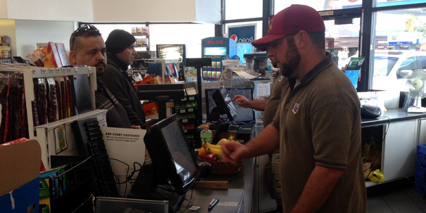 A customer purchases a Powerball ticket at a Chevron gas station in Phoenix, Ariz. (KTAR Photo/Mike...