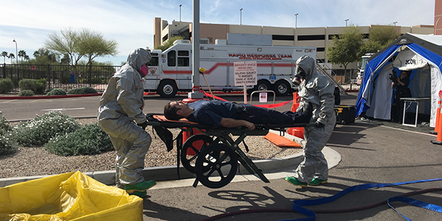 Three East Valley emergency workers participate in a hazmat drill on Monday, Feb. 29, 2016. (KTAR P...