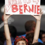 Lauren Esquivel displays a sign supporting Democratic presidential candidate, Sen. Bernie Sanders, I-Vt., at a campaign rally, Tuesday, March 8, 2016, in Miami. (AP Photo/Alan Diaz)