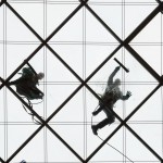 
              Two  window cleaners work on  the 27-meters-high glass ceiling of  a building in Dresden, Germany, Wednesday, March 30, 2016.  (Sebastian Kahnert/dpa via AP)
            