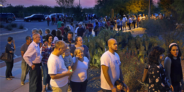 People wait in line to vote in the primary at the Environmental Education Center, Tuesday, March 22...