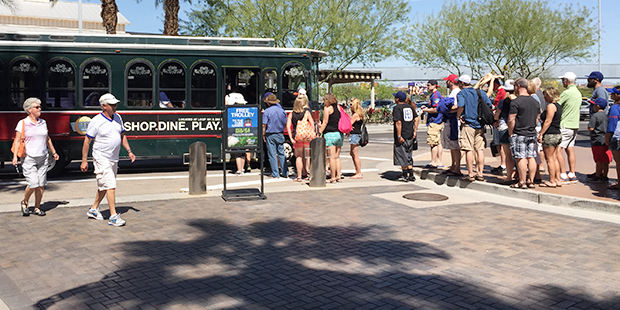 Chicago Cubs fans lineup to ride the free shuttle from Tempe Marketplace to Sloan Park. (Tempe Mark...