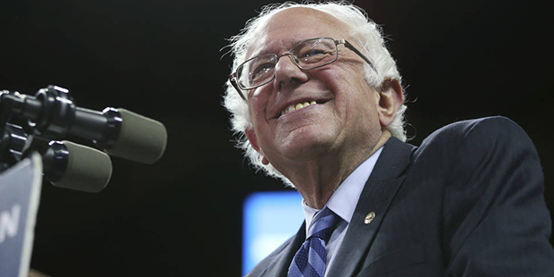 Democratic presidential candidate, Sen. Bernie Sanders, I-Vt., smiles as he speaks at a campaign ra...