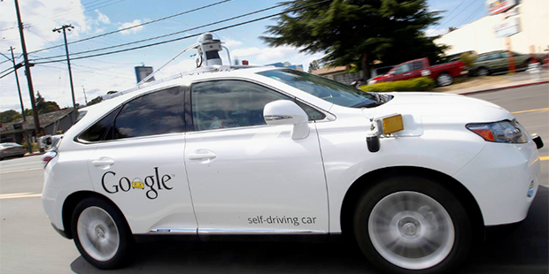 In this May 13, 2015, file photo, Google's self-driving Lexus drives along a street during a demons...