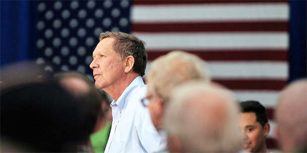 Republican presidential candidate John Kasich arrives to Central Medford High School in Medford, Or...