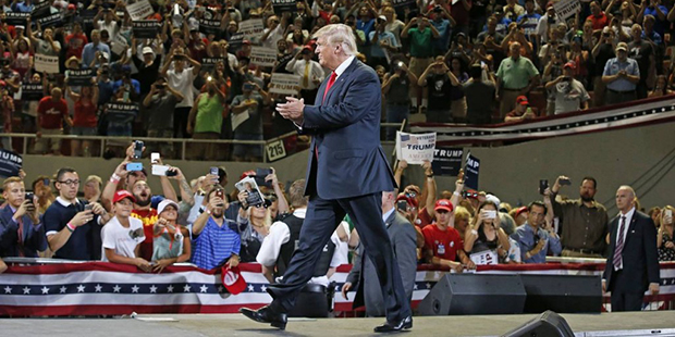 Republican presidential candidate Donald Trump arrives to speak at a rally Saturday, June 18, 2016,...