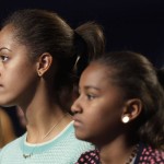 
              FILE - In this Jan. 19, 2013, file photo, Malia Obama, left, and her sister, Sasha Obama, right, listen during the Kids' Inaugural: Our Children. Our Future." event in Washington. Malia is among the millions of U.S. high school seniors who are nervously taking standardized tests, completing college admissions applications, filling out financial aid forms and writing personal essays, all on deadline, before spending the coming months anxiously waiting to find out if they got into their dream school. (AP Photo/Gerald Herbert, File)
            