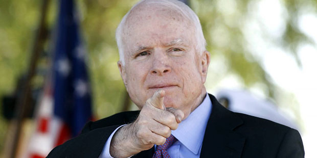 Sen. John McCain, R-Ariz, acknowledges a fellow Navy veteran during a Phoenix Memorial Day Ceremony...