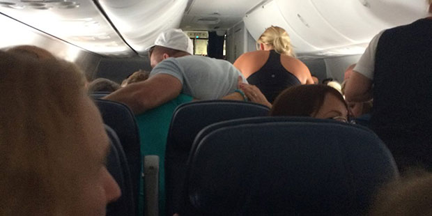 Tim Tebow (in white cap) comforts the family. (Facebook Photo)