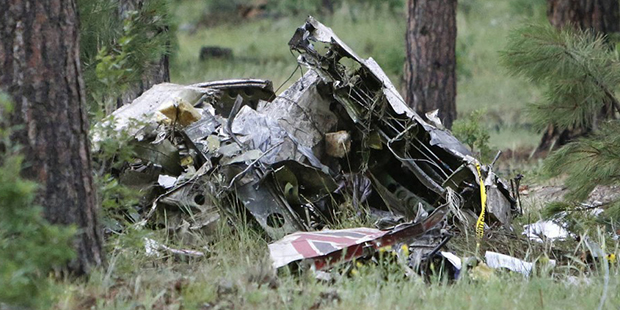 A pile of wreckage sits in the forest just south of Forest Highlands on State Route 89A near Flagst...
