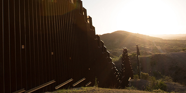 This border wall separates Nogales, Sonora (left) from Nogales, Ariz. (right). (Photo by Courtney P...