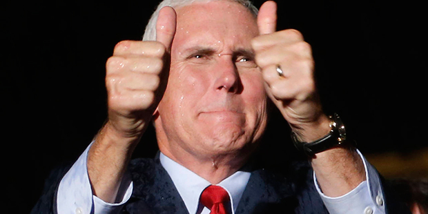 Republican vice presidential candidate Indiana Gov. Mike Pence, gives a thumbs up as he addresses a...