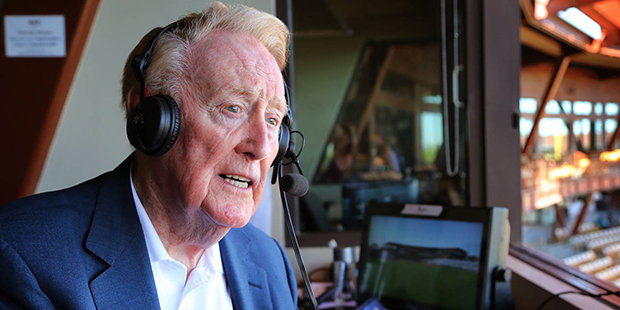 Legendary Los Angeles Dodgers broadcaster Vin Scully sits in the booth at Camelback Ranch Glendale,...