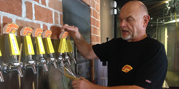 Uwe Boer, brewmaster at Sun Up Brewing in Phoenix, pours an Oktoberfest beer (Mike Sackley?KTAR New...