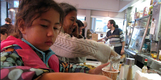 A family of refugees eats at a restaurant on October 30, 2012. (Flickr/Eden, Janine and Jim)...