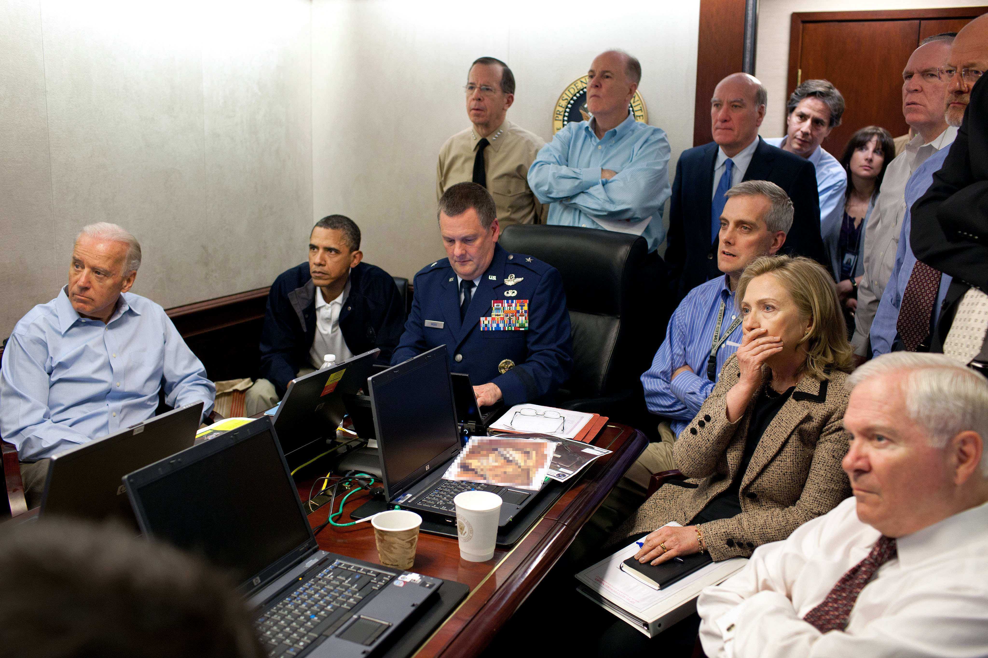 FILE - In this May 1, 2011 image released by the White House and digitally altered by the source to diffuse the paper in front of Secretary of State Hillary Rodham Clinton, President Barack Obama and Vice President Joe Biden, along with with members of the national security team, receive an update on the mission against Osama bin Laden in the Situation Room of the White House in Washington. (Pete Souza/The White House via AP)