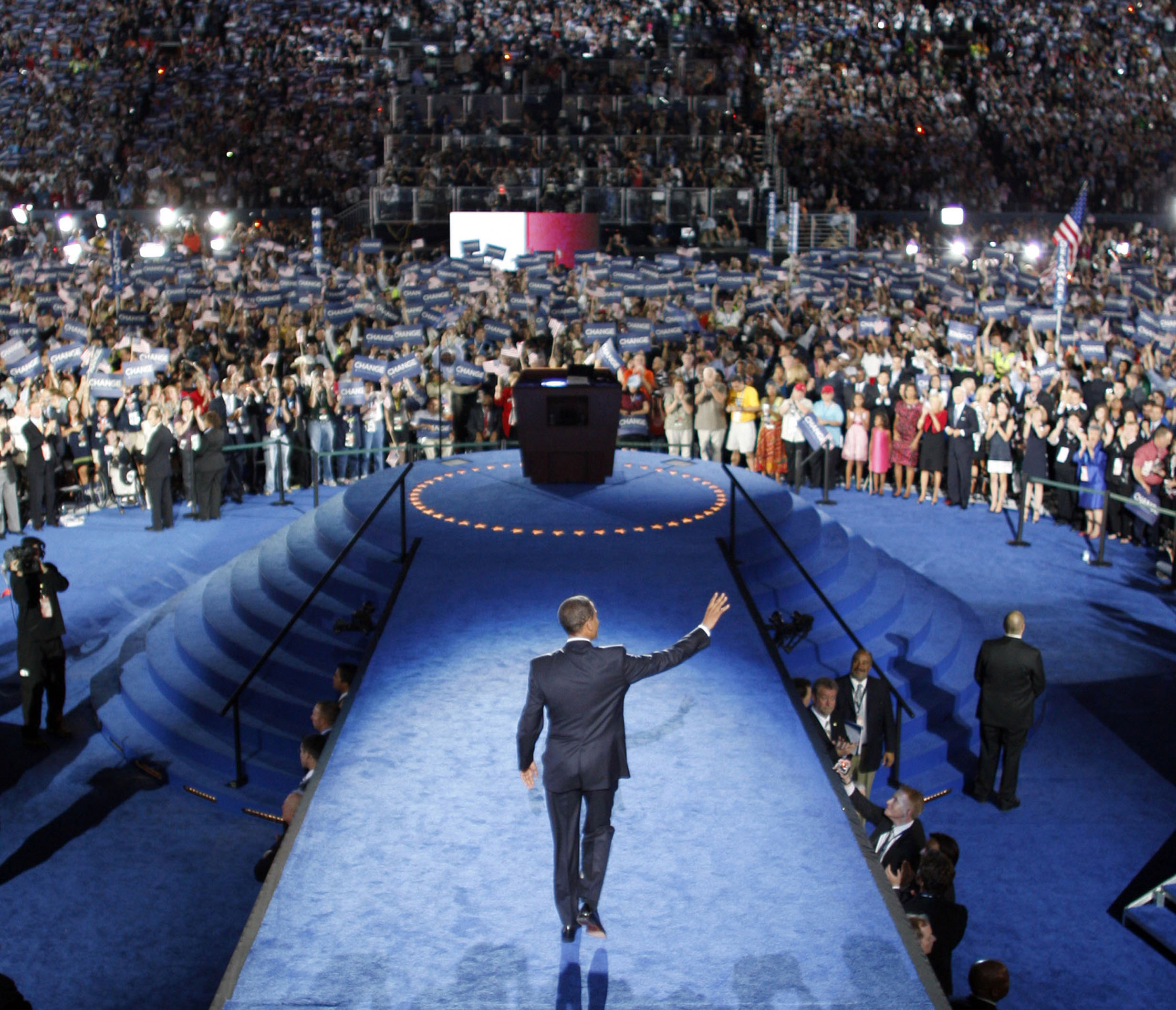 In this Aug. 28, 2008, file photo Democratic presidential candidate, Sen. Barack Obama, D-Ill., waves to the crowd as he prepares to address the Democratic National Convention at Invesco Field in Denver, Colo. (AP Photo/Scott Andrews and Chuck Kennedy, Pool)