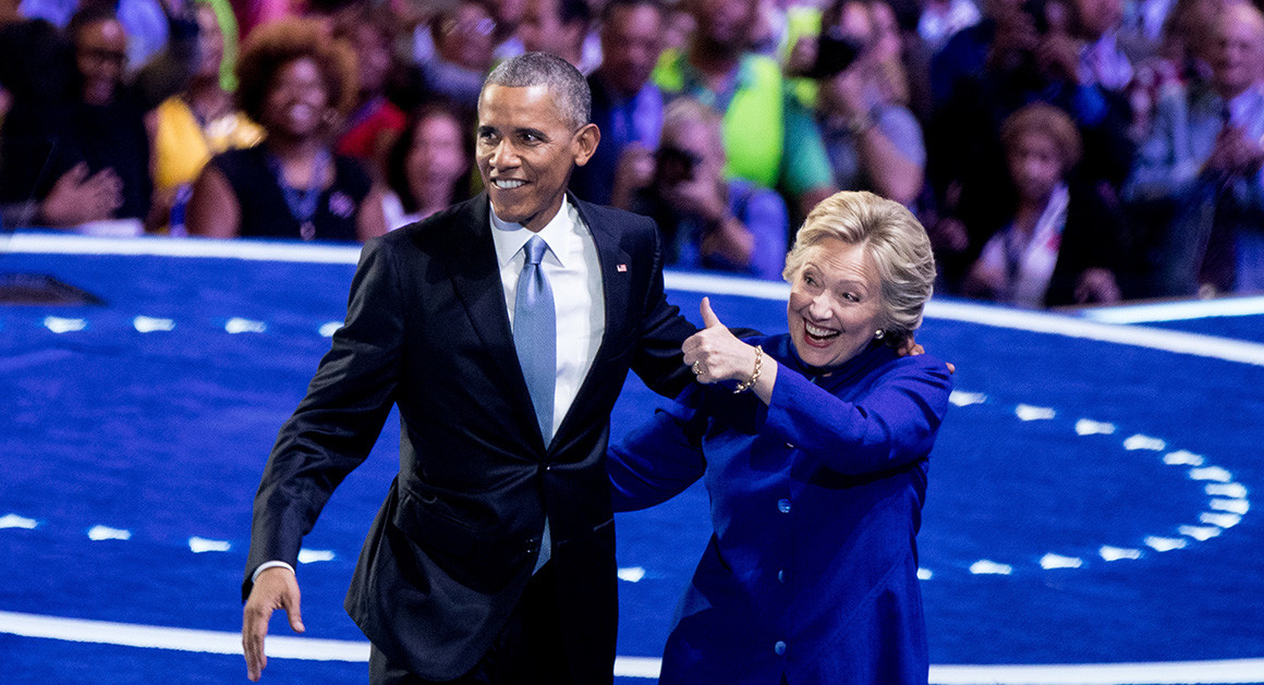Hillary Clinton joins President Barack Obama on stage at the Democratic National Convention on July 27. (AP Photo)