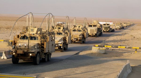 The last vehicles in a convoy of the U.S. Army's 3rd Brigade, 1st Cavalry Division crosses the border from Iraq into Kuwait Dec. 18, 2011. (AP Photo)