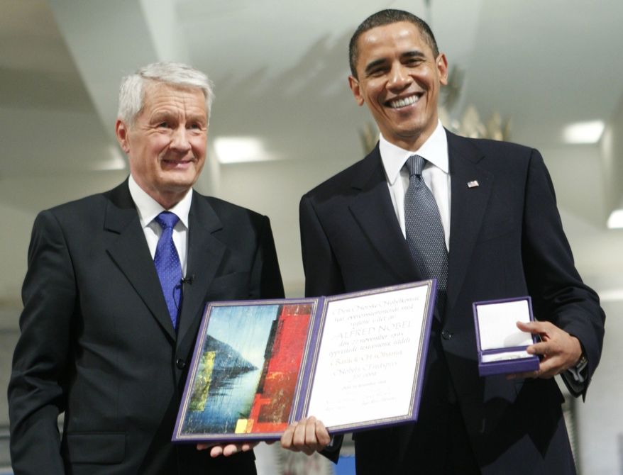 US President and Nobel Peace Prize laureate Barack Obama, right recieves his medal and diploma from the the Chairman of the Nobel committee Thorbjorn Jagland, left at the Nobel Peace Prize ceremony at City Hall in Oslo, Thursday, Dec. 10, 2009. (AP Photo Bjorn Sigurdson/ Scanpix Norway, Pool)