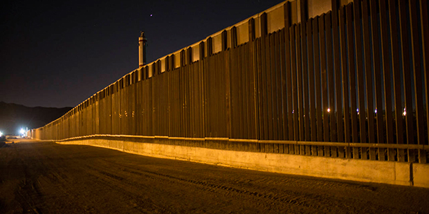 FILE - In this March 30, 2017 file photo, a portion of the new steel border fence stretches along t...