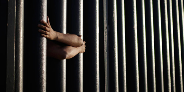 FILE - In this June 13, 2013, file photo, hands from Daniel Zambrano of Tijuana, Mexico, hold on to...