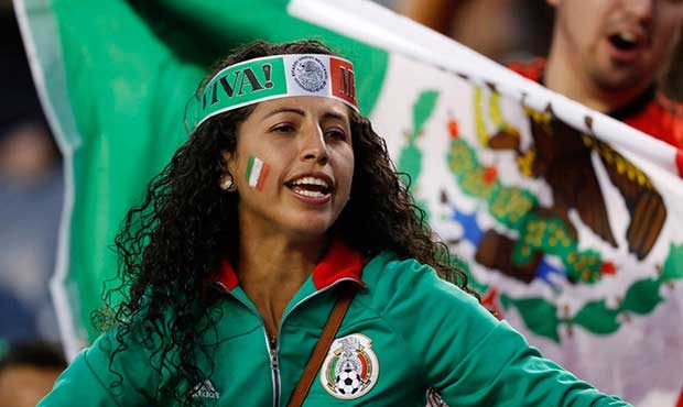 Fans cheer for Mexico at the team's CONCACAF Gold Cup soccer match against Jamaica on Thursday, Jul...