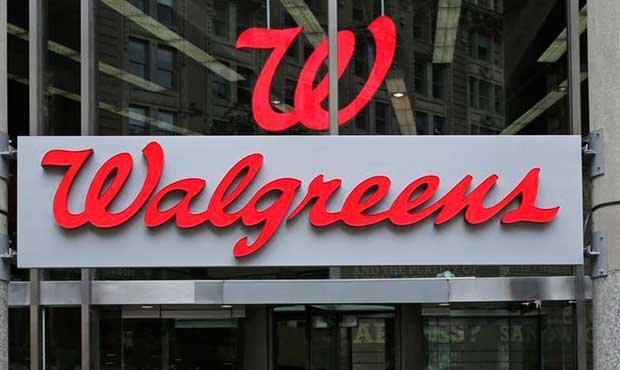 FILE - This June 4, 2014, file photo, shows a Walgreens retail store in Boston. (AP Photo/Charles K...