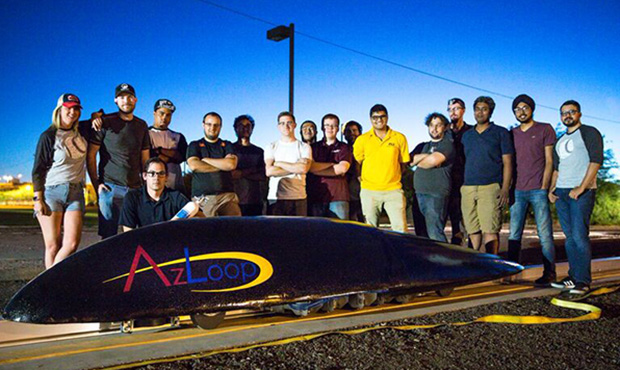 Members of the AZLoop team pose with their competition pod at the group’s 150-foot test track on ...