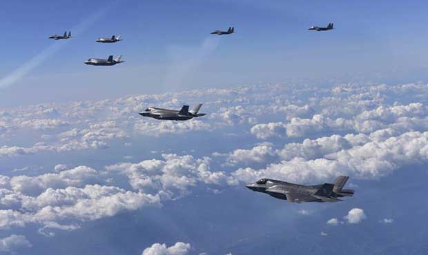 In this photo provided by South Korea Defense Ministry, U.S. Air Force F-35 stealth fighter jets an...