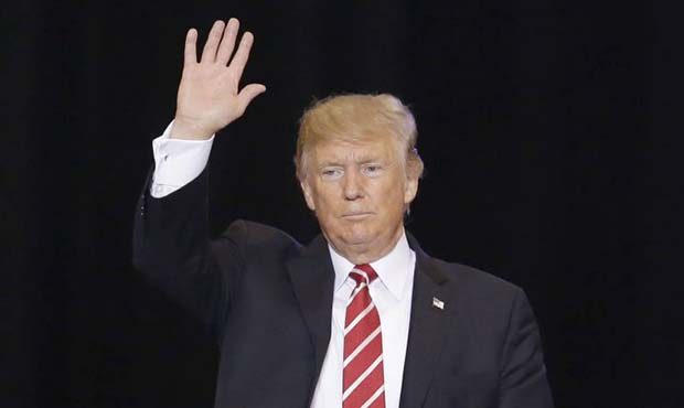 President Donald Trump waves to supporters at a rally at the Phoenix Convention Center, Tuesday, Au...