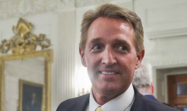 FILE - In this July 19, 2017 photo, Sen. Jeff Flake, R-Ariz. walks to his seat as he attends a lunc...