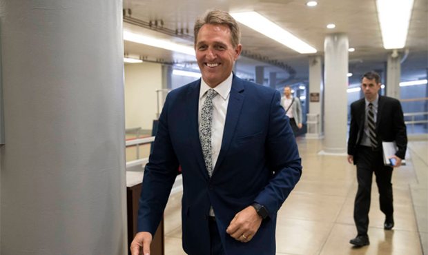 Sen. Jeff Flake, R-Ariz., a member of the Foreign Relations Committee, arrives for the start of a c...