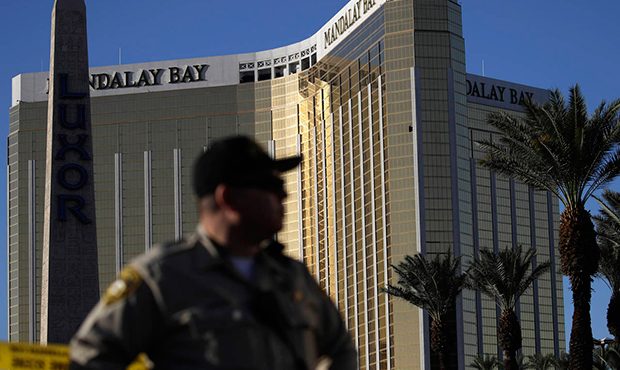 FILE - In this Tuesday, Oct. 3, 2017 file photo, a Las Vegas police officer stands by a blocked off...