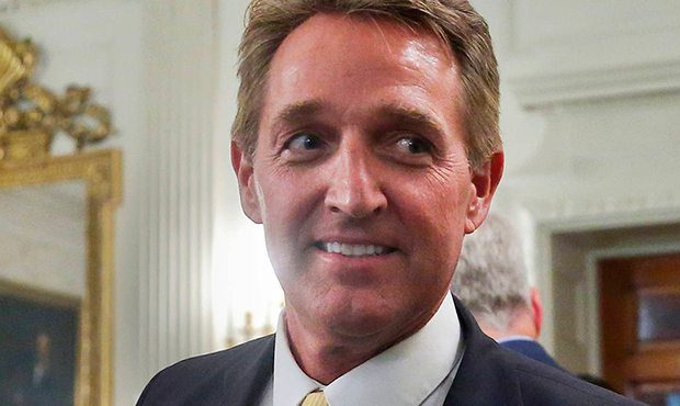 In this photo taken July 19, 2017, Sen. Jeff Flake, R-Ariz. walks to his seat as he attends a lunch...