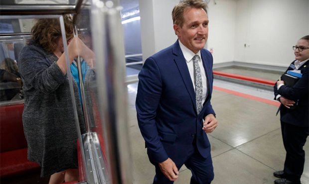 Sen. Jeff Flake, R-Ariz., a member of the Foreign Relations Committee, returns to his office after ...