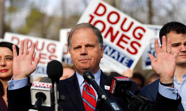 Democratic candidate for U.S. Senate Doug Jones speaks to reporters after voting Tuesday, Dec. 12, ...