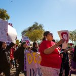 Jmi May Jackson from the Colorado River Indian Tribe Reservation marches honoring the missing and murdered indigenous women at the Women's March in Phoenix. "It's the future, it's history," she said. "It's showing our nieces, our nephews and kids, it's okay to lead, not follow." (Photo by Melina Zuniga/Cronkite News)