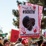 Indigenous men and women used the #MMIW hashtag at the Women's March in Phoenix to honor missing and murdered indigenous women. (Photo by Melina Zuniga/Cronkite News)