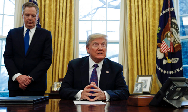 President Donald Trump, joined by U.S. Trade Representative Robert Lighthizer, left, waits for memb...