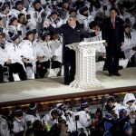 
              Thomas Bach, president of the International Olympic Committee, speaks as Lee Hee-beom, president & CEO of the PyeongChang Organizing Committee for the 2018 Olympic and Paralympic Winter Games, right, listens during the opening ceremony of the 2018 Winter Olympics in Pyeongchang, South Korea, Friday, Feb. 9, 2018. (Sean Haffey/Pool Photo via AP)
            