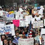 Crowds of people hold signs on Pennsylvania Avenue at the "March for Our Lives" rally in support of gun control, Saturday, March 24, 2018, in Washington. (AP Photo/Alex Brandon)
