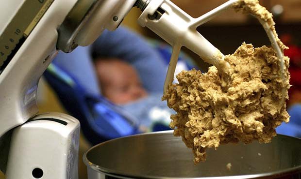 FILE - In this undated file photo, cookie dough clings to the beaters of a standing mixer. (AP Phot...