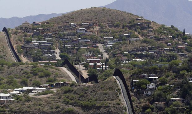 The International border cuts through Nogales, Sonora, Mexico, right, and Nogales, Ariz., as seen T...